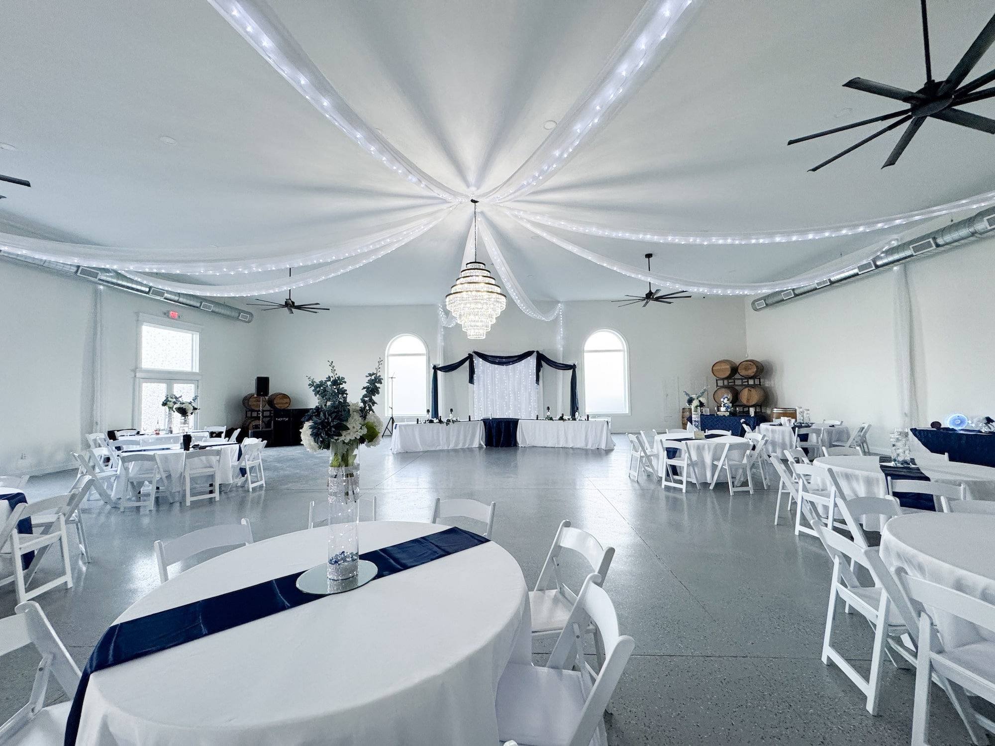 Reception hall interior with elegant table settings at Crume Haven Winery